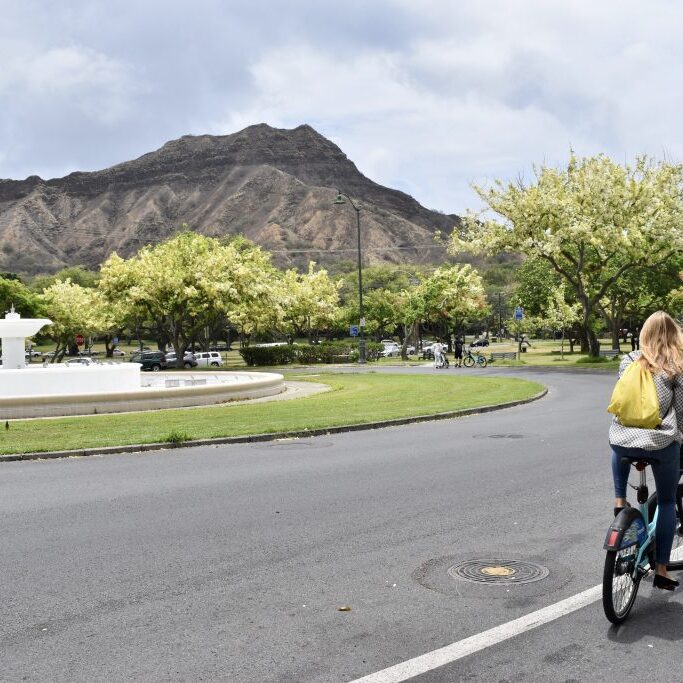 Riding on Kalakau Ave past the Louise Dillingham Memorial Fountain